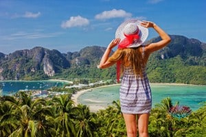 Girl standing with hat at viewpoint 3 phi phi island