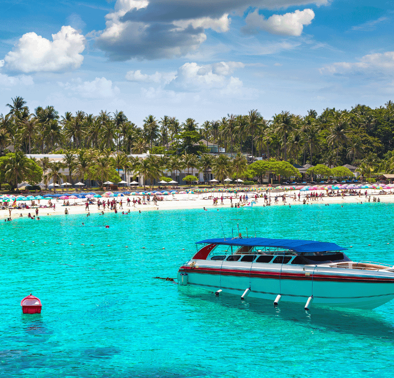 Racha beach and speedboat parked on crystal clear water