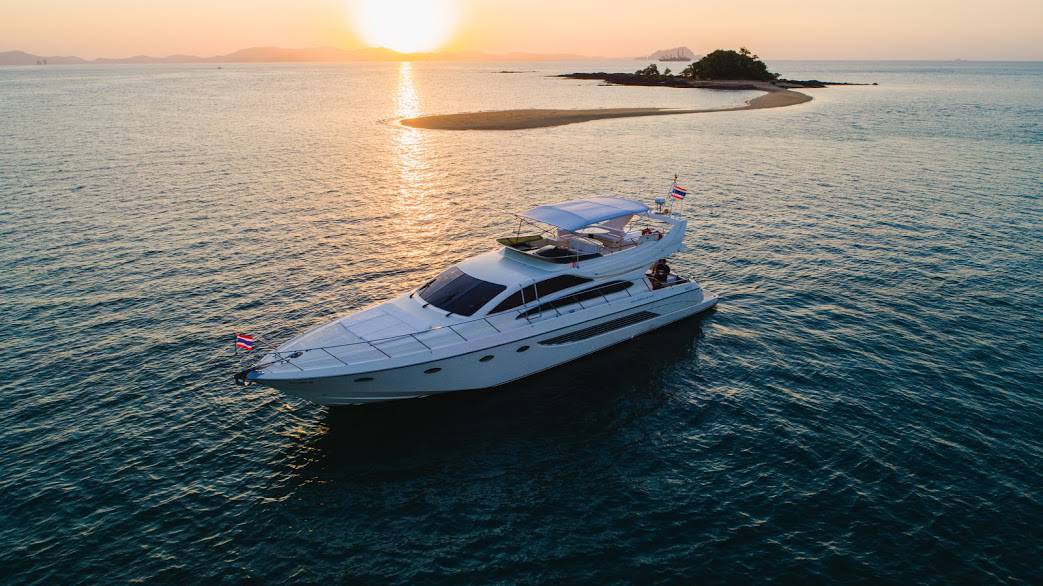 Phuket blog & news- stunning super yacht cruising with the sunsetting in the background