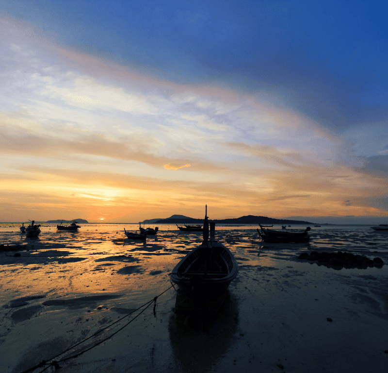 Breathtaking Sunrise Phuket Viewpoints 2025 Sunrise at rawai beach at low tide.